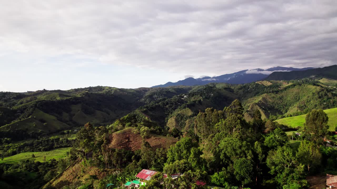 Drone launches from jungle canopy to reveal rolling Andean valleys, Aerial