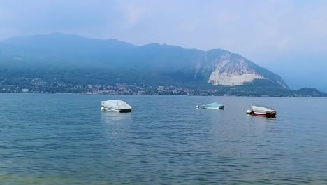 small boats on lake maggiore in italy