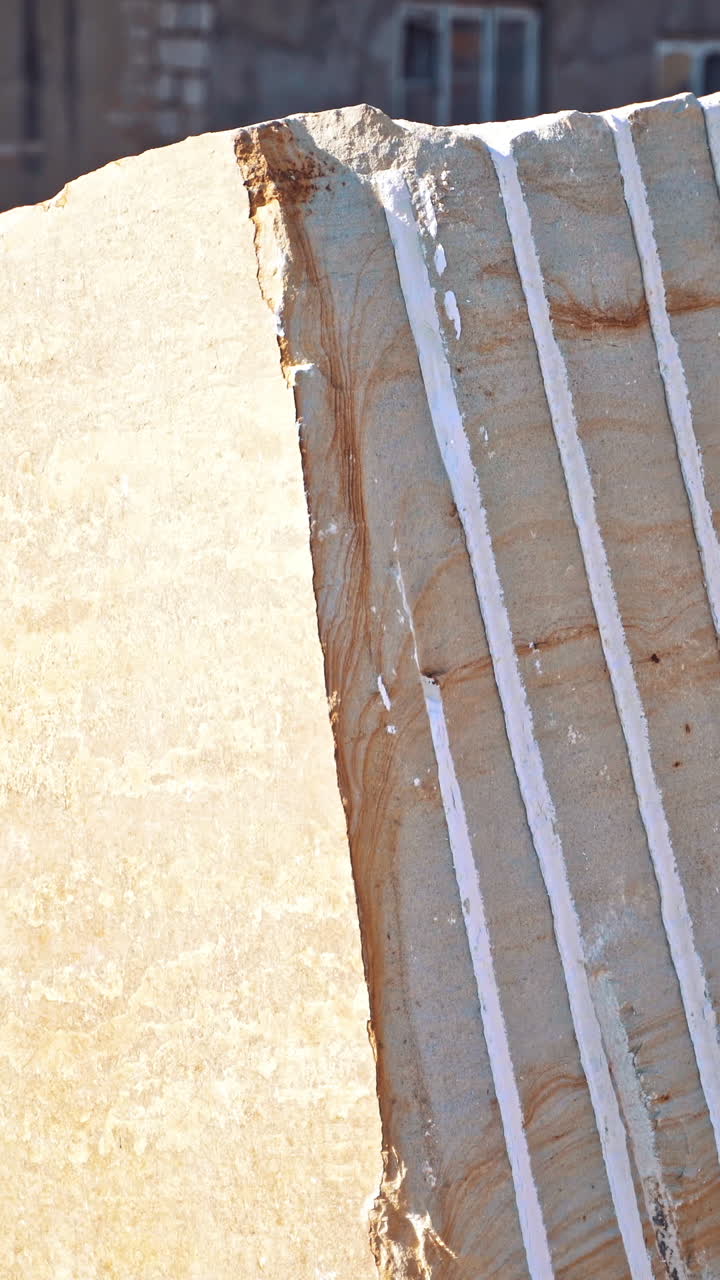 Forklift moving pallet with marble. Industrial heavy machinery forklift transporting big marble block Vertical video