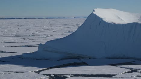 Iceberg-and-sea-ice-with-penguin-in-Antarctica