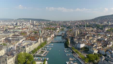 slow aerial dolly over limmat river in downtown zurich, switzerland