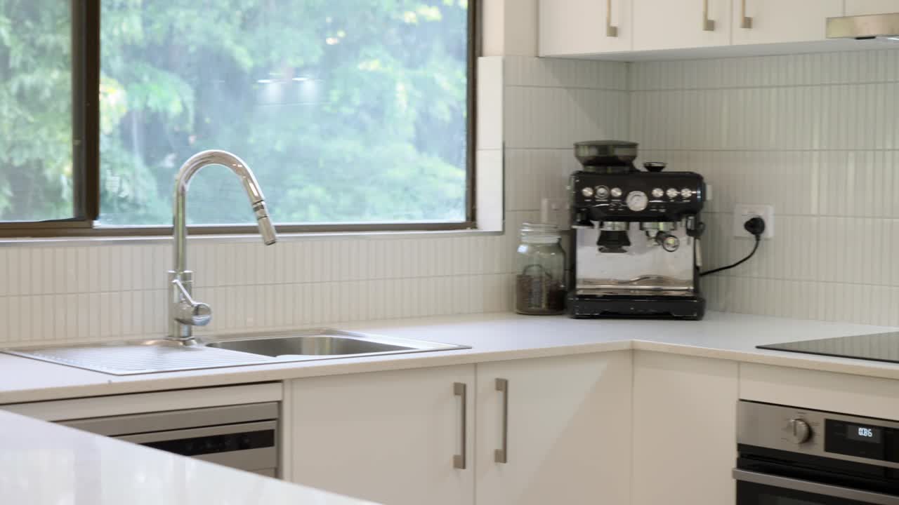 Modern White Kitchen with Espresso Machine