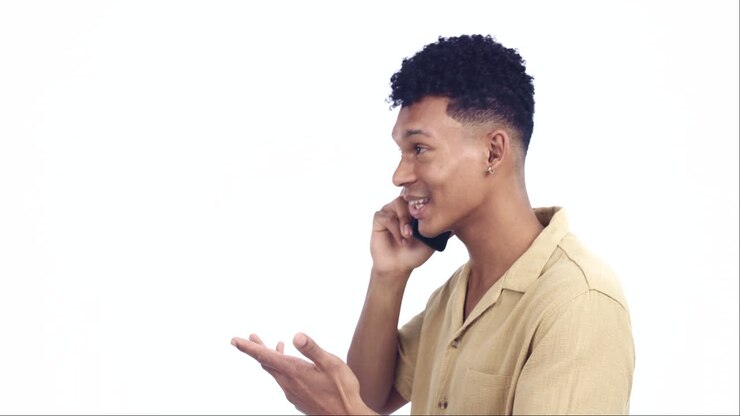 Young man, phone call and happy in studio