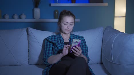 Woman-lying-on-sofa-is-using-phone.-Pleasant-and-comfortable-posture.