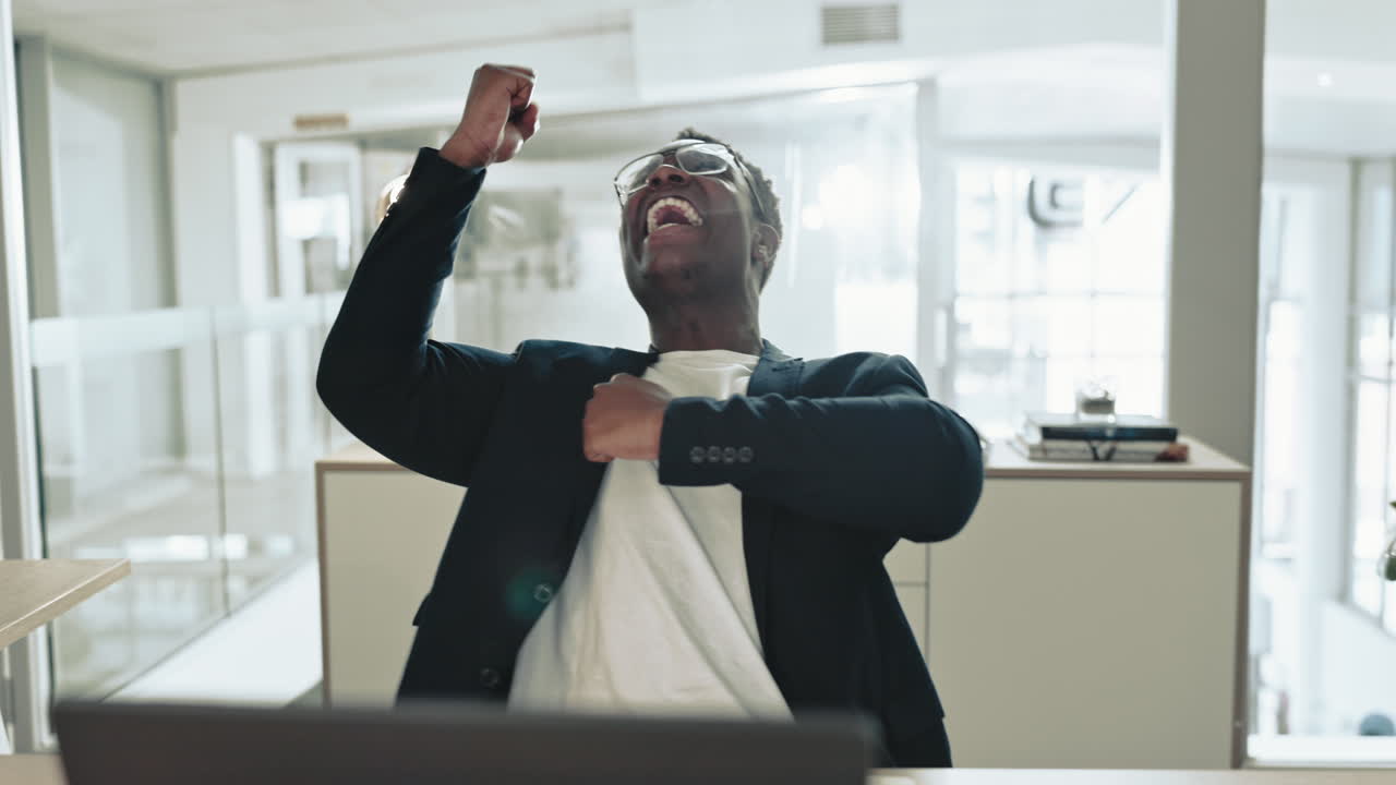 Excited black man, laptop and success in office