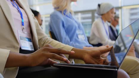 Businesswoman-using-laptop-in-the-business-seminar-4k