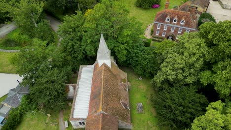 An-angled-push-in-shot-over-All-Saints-church-in-West-Stourmouth