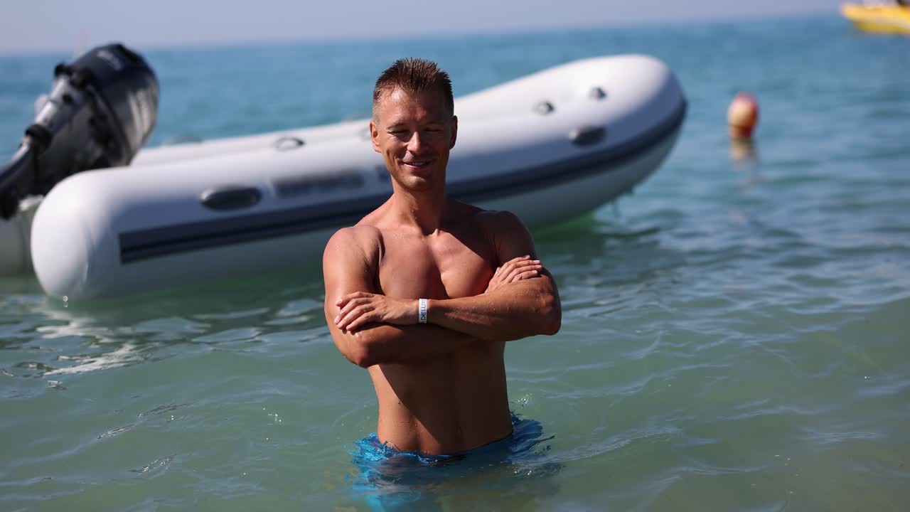 Man in the sea with a boat