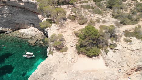 Spain-Mallorca-Cala-Llombards-and-Cala-Santanyi-at-4k-24fps-with-ND-filters-flying-with-a-DJI-Mavic-Air-with-beautiful-views-of-the-beaches,-rocks,-boats-and-blue-water