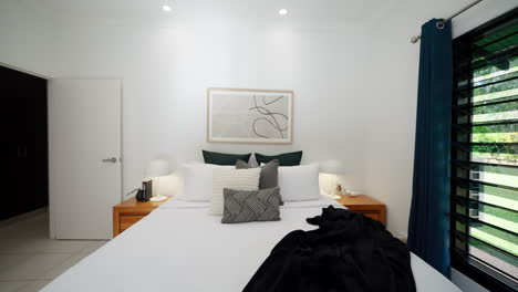 Dolly-to-beautiful-modern-masterbedroom-with-grey-white-black-color-palette,-mirror-doors-on-cabinet-and-jealousie-windows