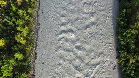 The-river-turns-milky-white-due-to-quarry-pollution-or-containing-minerals-in-the-water,-Alaska-USA