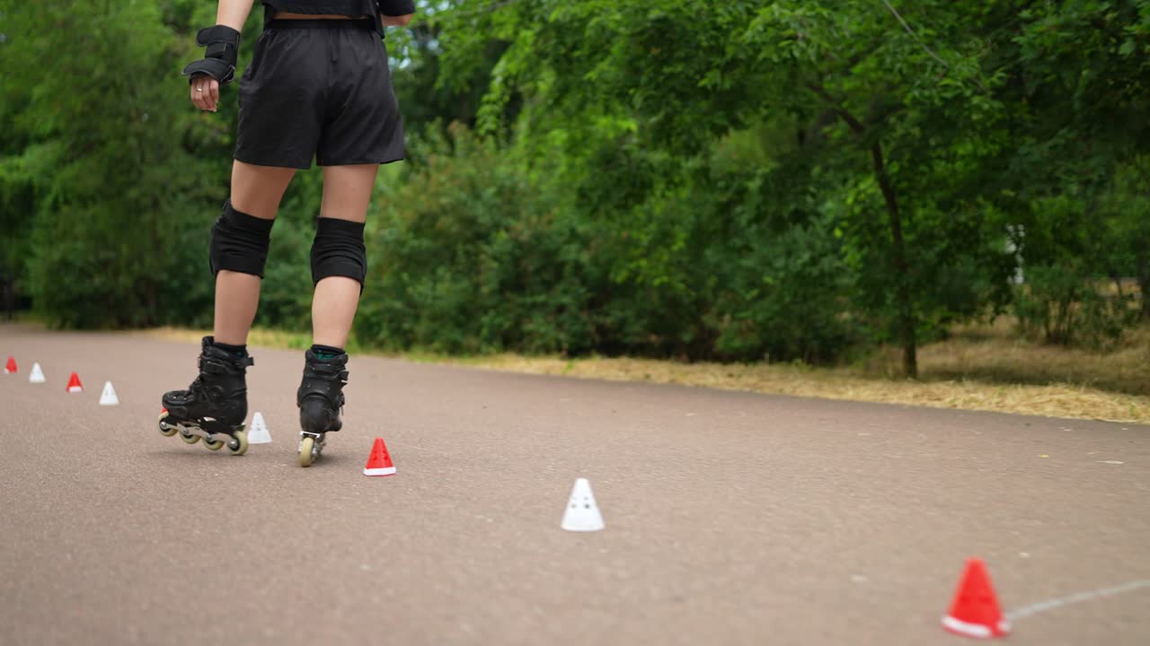 Woman roller skating on a park path