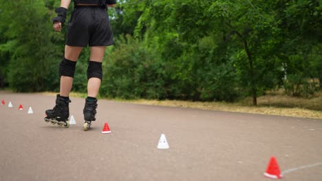 woman roller skating on a park path