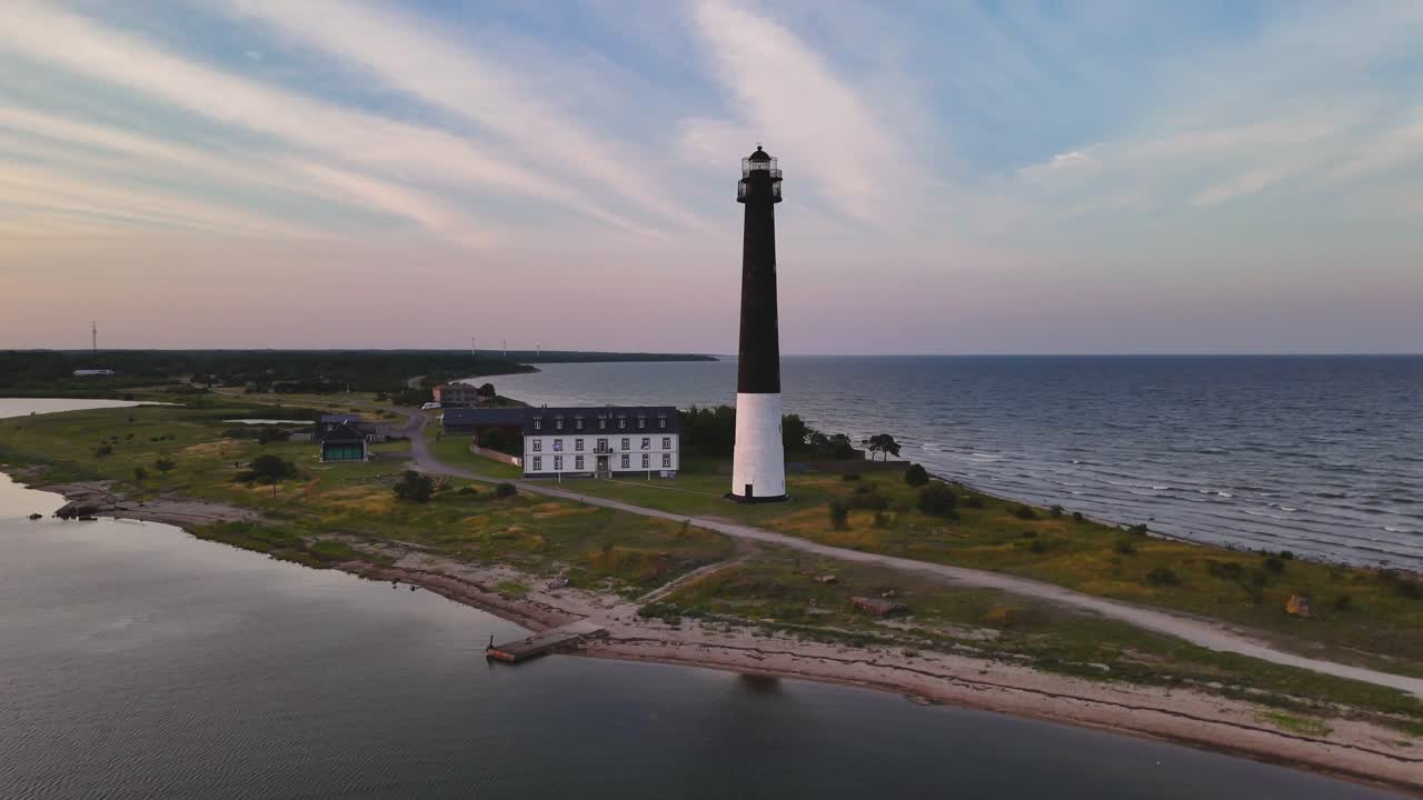 Aerial drone view during sunset at the lighthouse in the end of the Sõrve peninsula in Saaremaa, Estonia.