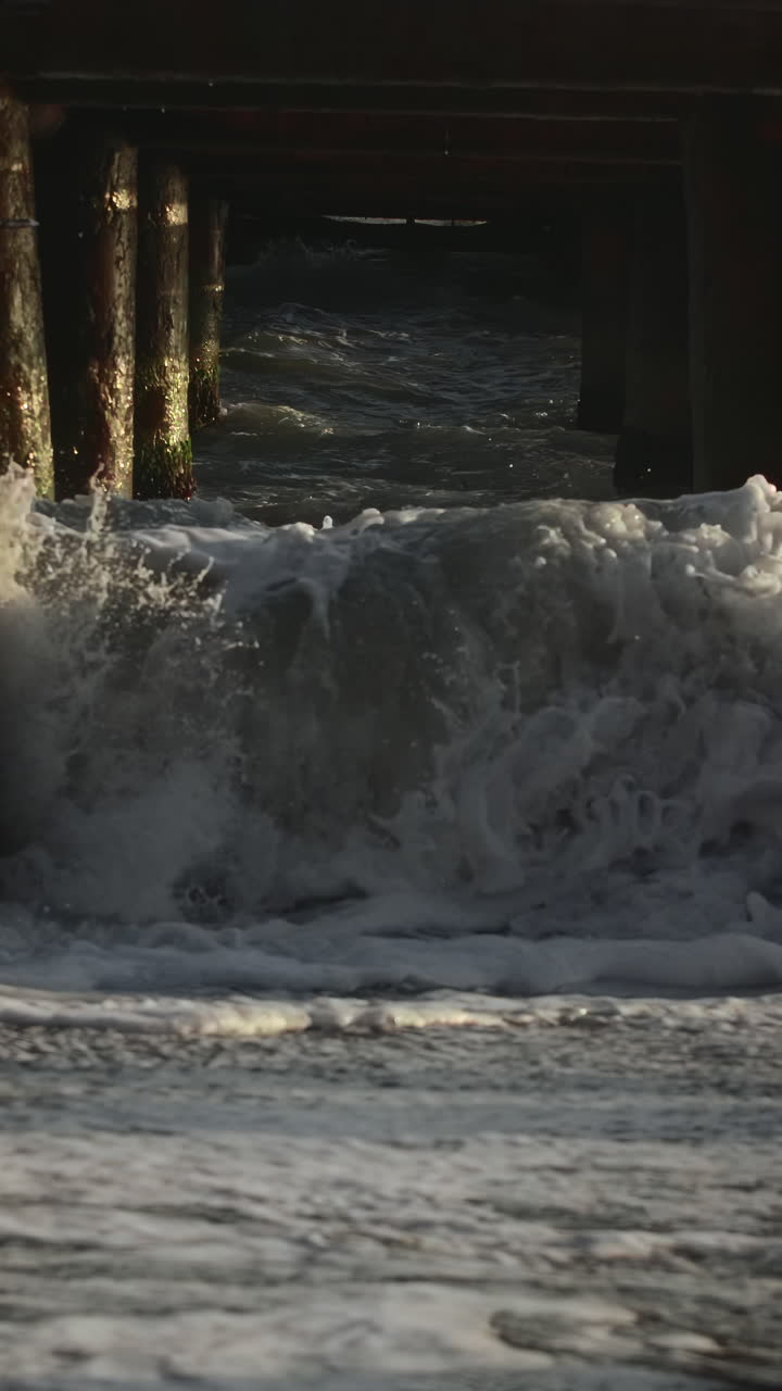 Waves crashing against a pier