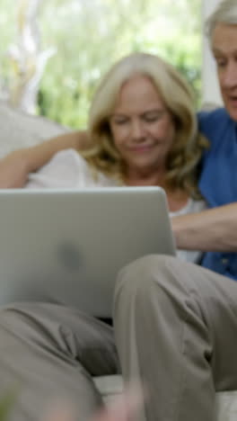 senior couple using laptop