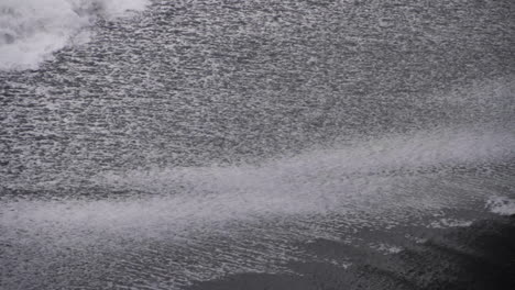 Waves-Splash-against-Shore-on-Icelandic-Black-Sand-Beach