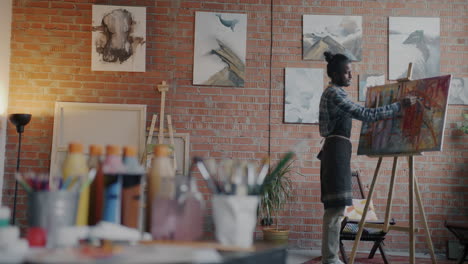 artist painting in a studio