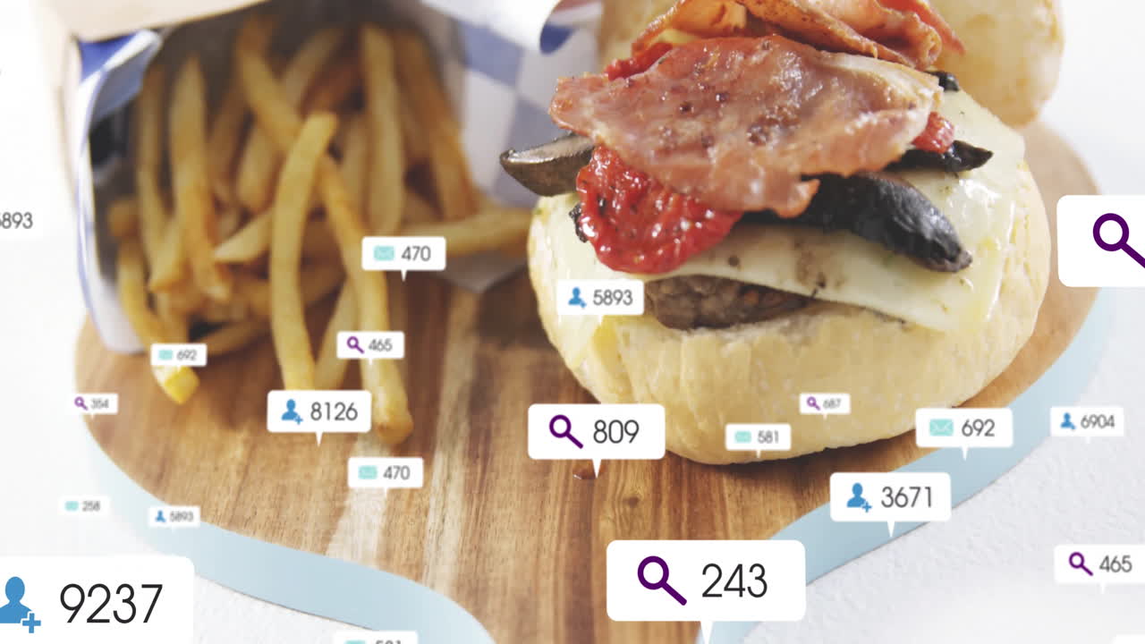 Animation of burger and fries with social media icons overlaying scene