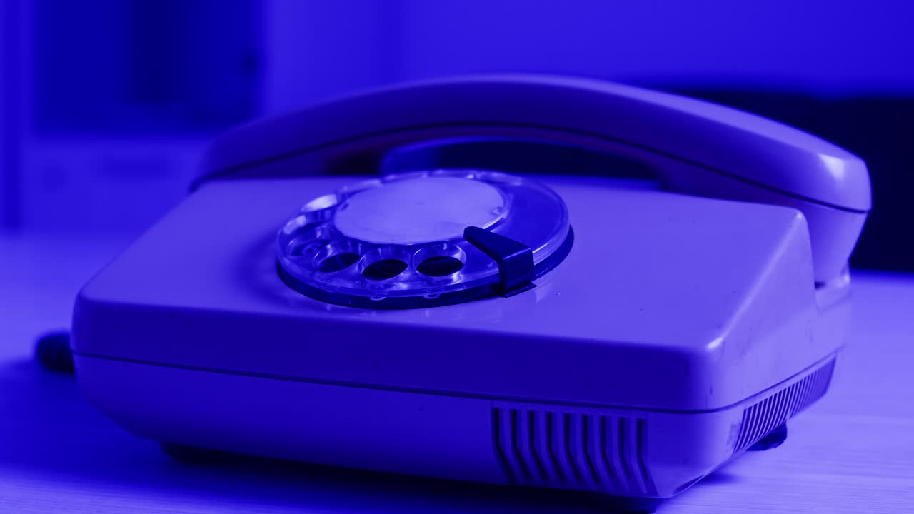 Retro vintage phone, A yellow rotary telephone is displayed on a wooden desk, adding a nostalgic touch