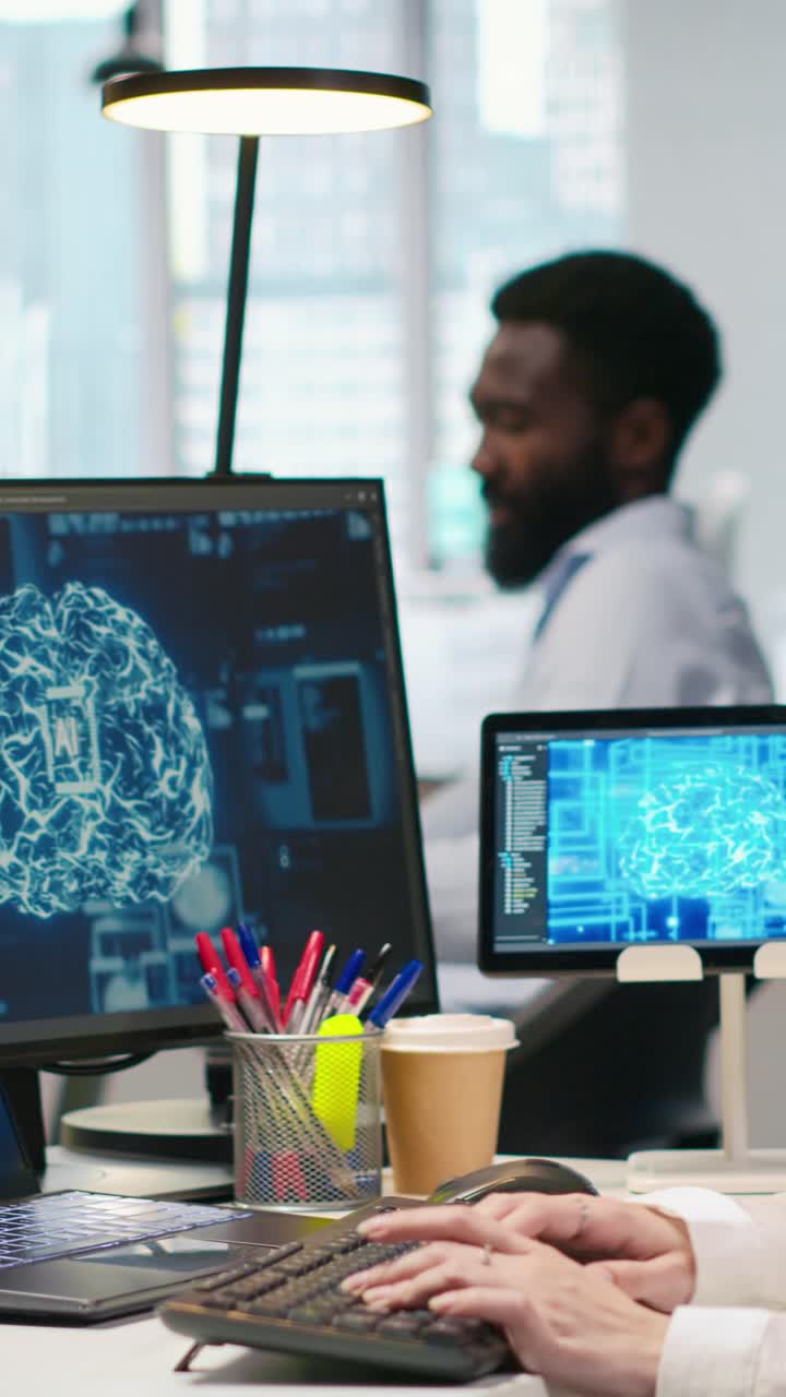 Vertical video IT expert in high tech startup office uses neural networks to develop AI