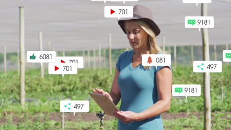mature woman interacting with tablet in plant nursery, featuring floating social media icons