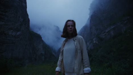 woman hiking in a misty mountain valley