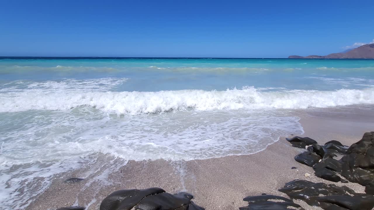Panoramic Mediterranean Beauty: Azure Sea, White Waves Splashing on a Beautiful Beach in a Captivating Showcase of Coastal Serenity in Albania
