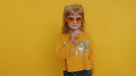 smiling playful happy young preteen child girl kid walking slowly and looking at camera, flirting