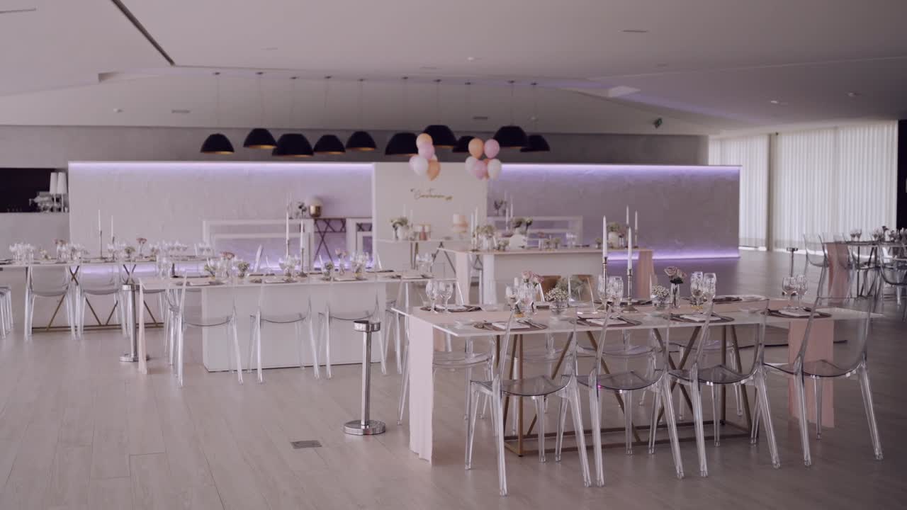 Chic event space with elegant table settings and minimalist decor