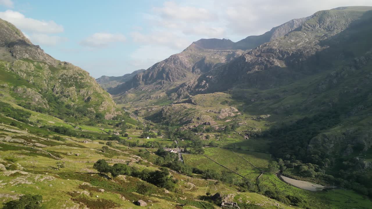 Stunning Pen-y-Pass - aerial drone flyover, Crib Goch background on a sunny summer afternoon - North Wales, UK