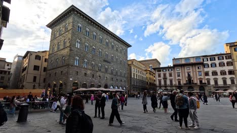 people interacting in a historic town square