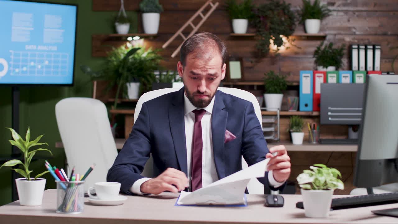 Tired and Stressed Businessman in Office