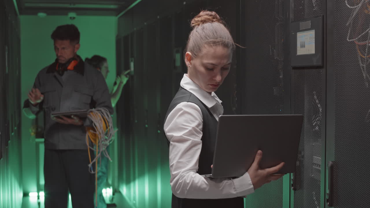 Data Center Technicians Working on Servers
