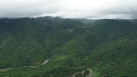 Hyperlapse-of-the-Mexico-Tuxpan-highway,-a-bridge-crossing-the-green-rainy-mountains