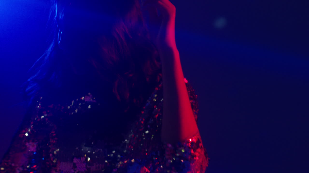 Close Up Of Woman In Nightclub Bar Or Disco Dancing With Sparkling Lights 3