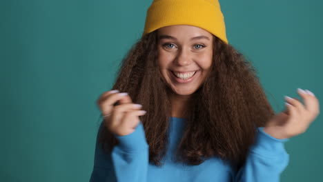 caucasian curly haired woman wearing winter clothes.