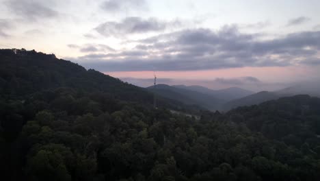 Aerial-push-toward-and-past-communication-tower-near-boone-nc,-north-carolina