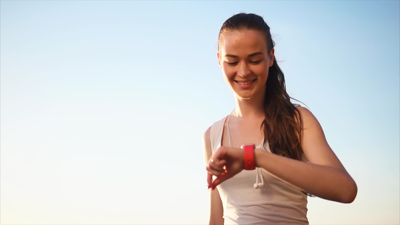 Woman Checking Smartwatch Outdoors
