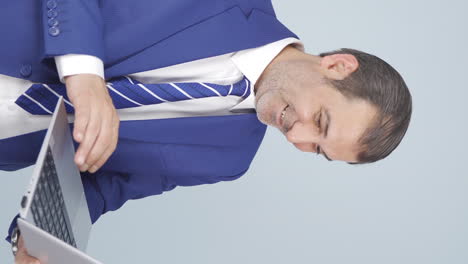 Vertical-video-of-Businessman-looking-at-laptop-with-excitement.