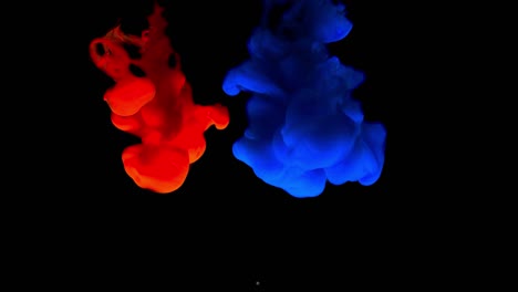 colorful paint drops mixing in water. abstract color mix background. colorful ink in water