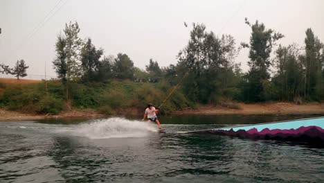 man wakeboarding in the river 4k