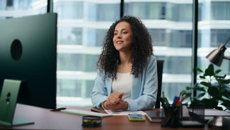 woman greeting colleagues video conference closeup. businesswoman talking online