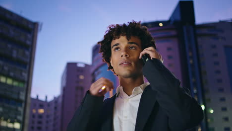 Calling-businessman-waiting-night-business-district-closeup.-Guy-talking-mobile