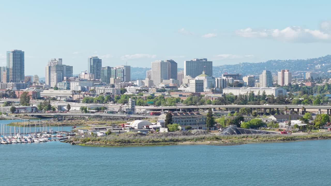 A slow rotating aerial shot of Downtown Oakland California late afternoon. Shot in real time in 4K.