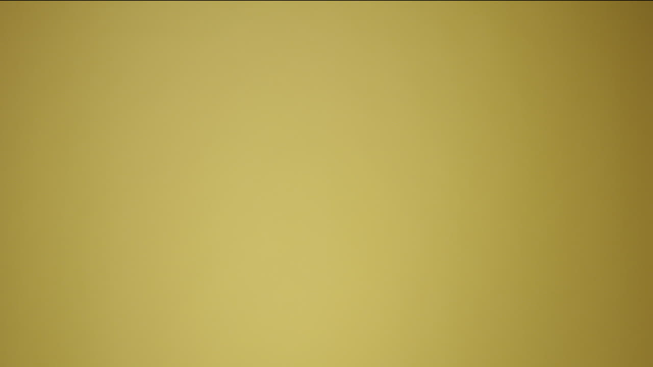 Man Holding Clapperboard in Studio