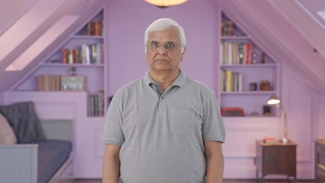 indian old man staring at the camera