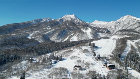 Aerial-view-orbiting-peak-of-Mount-Myoko,-Akakura-Onsen