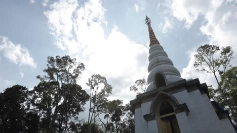 Old-Buddhist-Temple-in-jungle-in-Thailand-with-blue-skies-and-clouds-4K-Footage