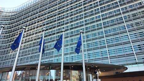 low-angle view of eu flags waving outside european commission office